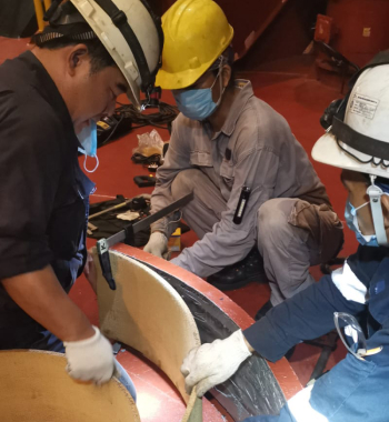 Team of marine engineers in action