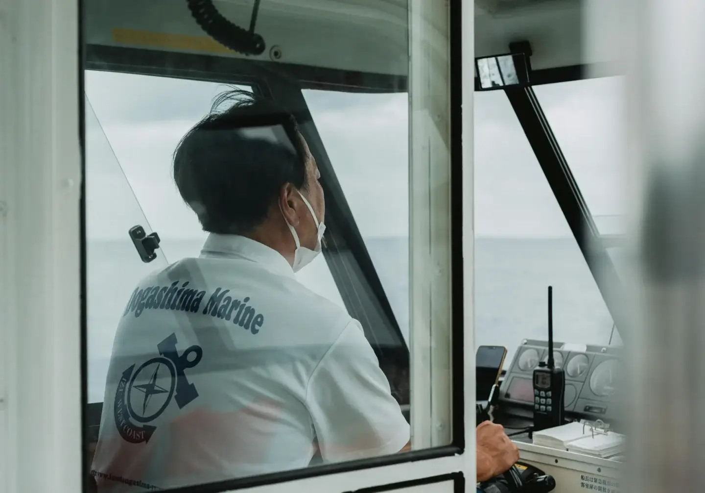 maritime engineering company, A male marine ship captain focused on work