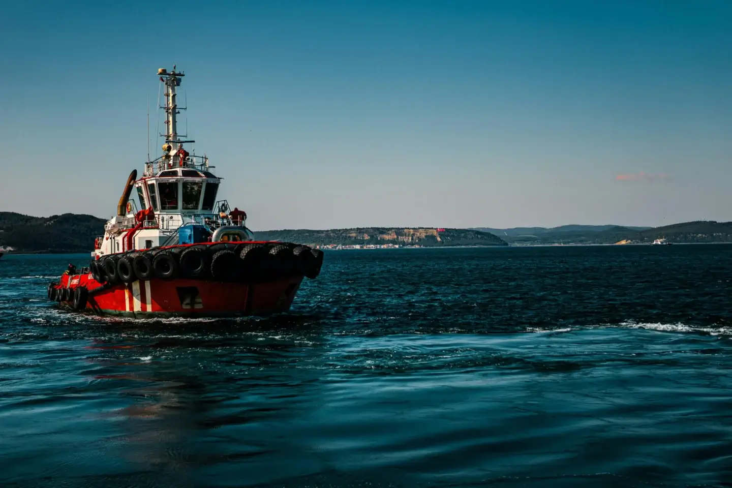 starting air compressor, A small boat sailing on a day time