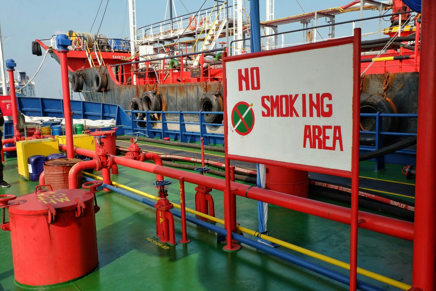 Deck of an industrial marine vessel with no smoking area sign