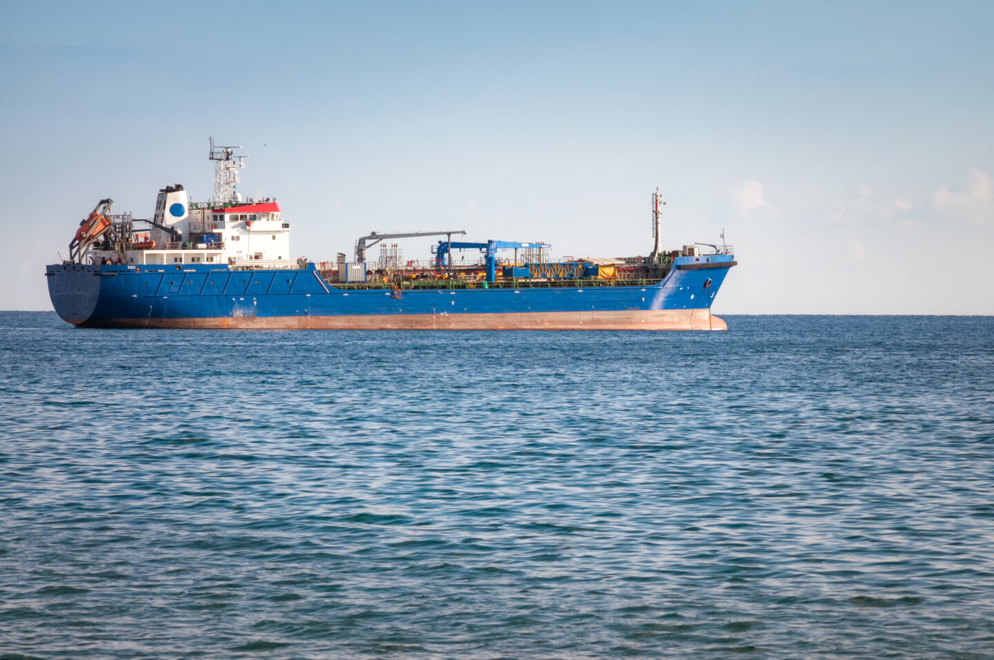 A cargo ship in the ocean sailing 